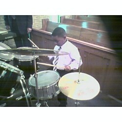 Son on drums