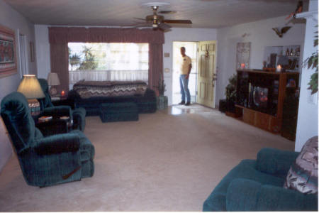 Living room in Florida, me in door.