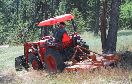 Mowing the hillside for fire safety