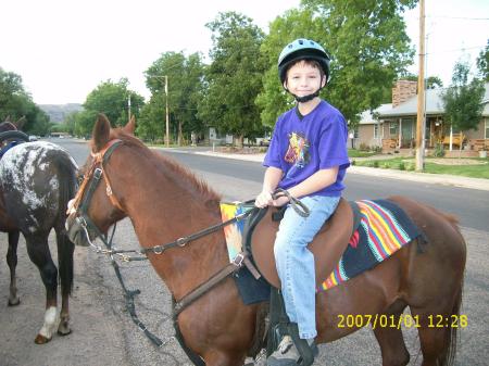Dylan getting ready to ride Penny in a parade