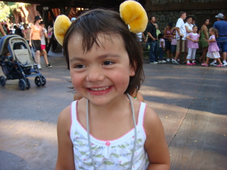 Maddie beaming with her Pooh ears