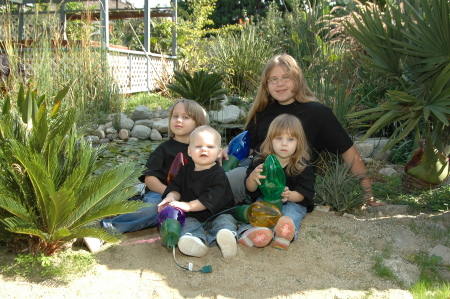 Our 4 Grand kids in Our Back yard by the POND!!