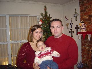 My youngest daughter, her fiancee and my grandson