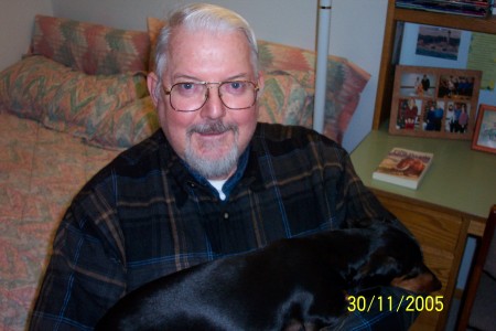 Tom, at the computer with Willie, the dachshound!