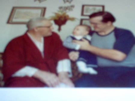 This is my oldest son Joel, me & my dad on Joel's first Christmas