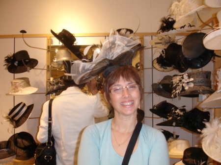 Trying on Ascot hats in England