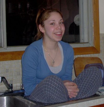 Kady sitting in the kitchen sink