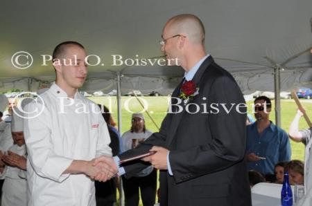 Damian receiving diploma