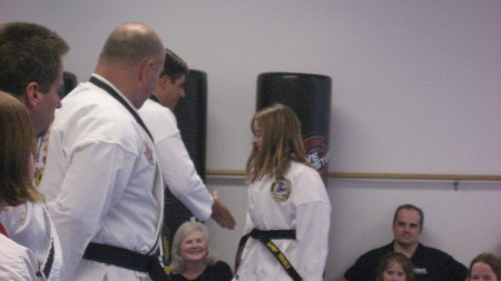 Darby is awarded her 1st Degree Black Belt