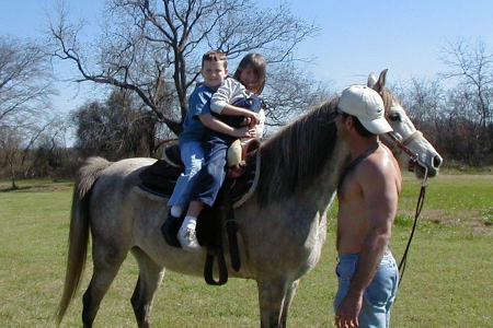 My son, Matt, taking his kids, Nathan and Alyssa riding.