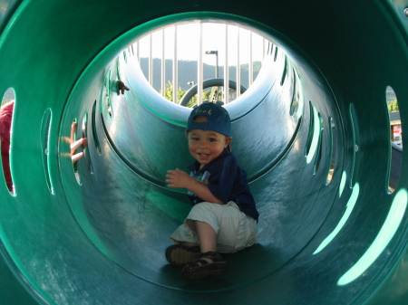Jayden playing in the tunnel