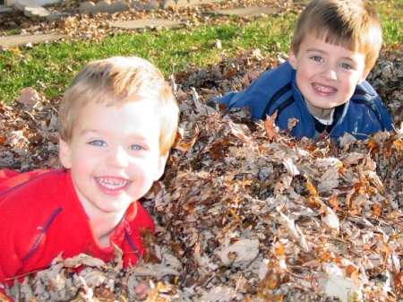 Boys playing in the leaves