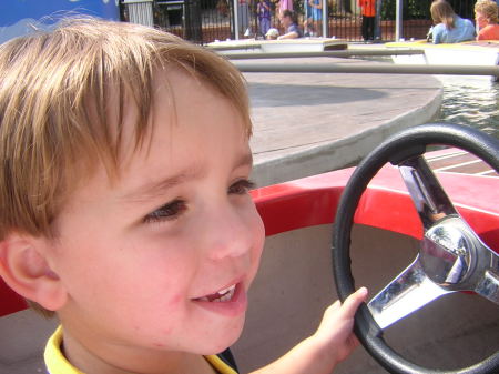 Holden driving a boat