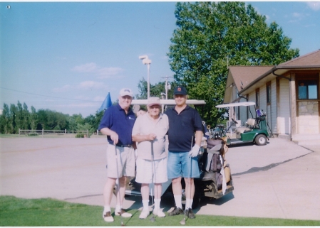 golfing with my dad Alf (ctr) and my brother Zack (rt)