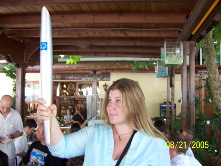 Holding the Olympic torch from the Athens 2004 games