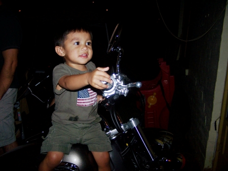 My boy playing with my bike