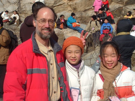 with school children on winter hike in mountains, China