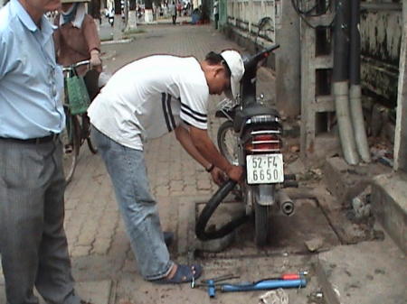 the mechanic fixing our bike