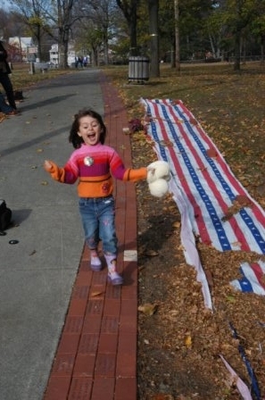 My daughter tromping on the Veteran's memorials