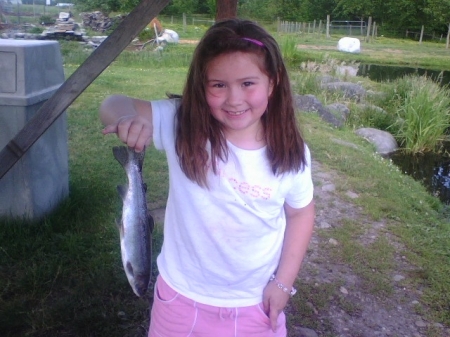 Courtney fishing with dad. (7 years old)