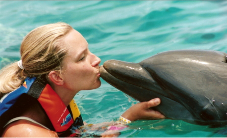 Me kissing a dolphin in Cancun - 2005