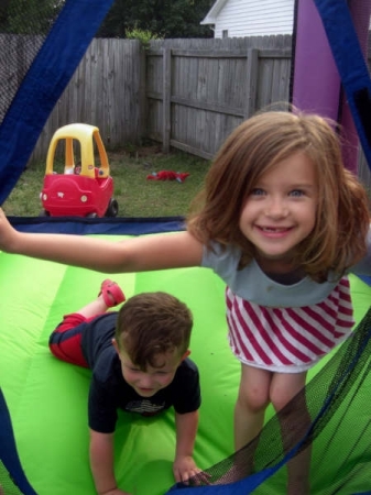 Kids in the bounce house playing!