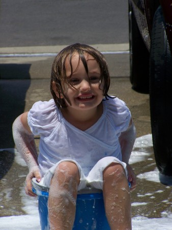 Nevaeh washing the car, opps herself...