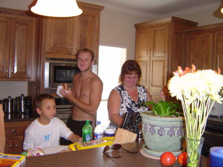 Wife and boys in the kitchen eating