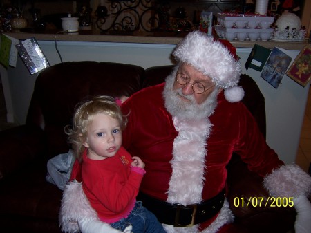My daughter Sydne and Santa(grandpa)