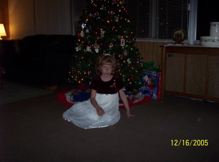 My daughter in front of our tree 2005