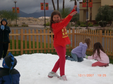 My daughter Emily throwing snow.