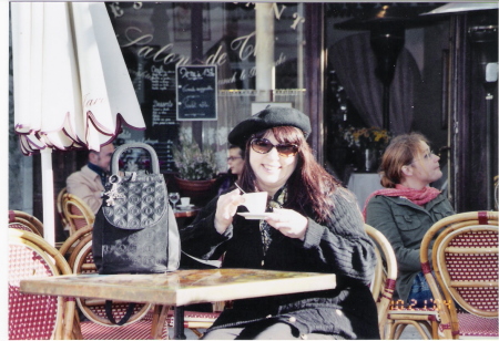 Me sitting at a cafe in Paris