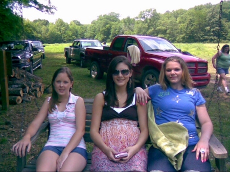 Kayla n Maegan with friend on swing...