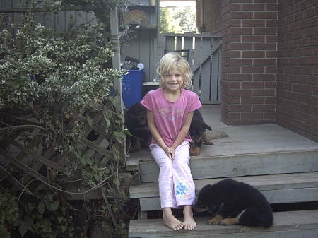 Brook-Lyn with some of the Rottie Pups!