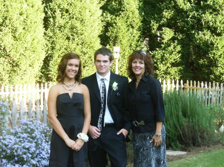 Nate with his girlfriend & her mom before freshman dance.