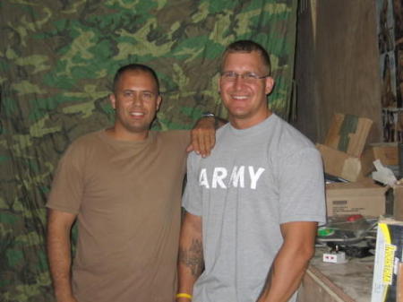 My buddy and I all tan in Iraq.