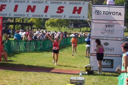 My wife finishing another triathlon.