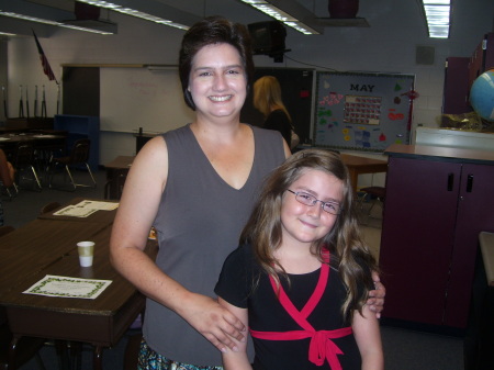 This is me and Amanda at her 5th grade graduation, June 07