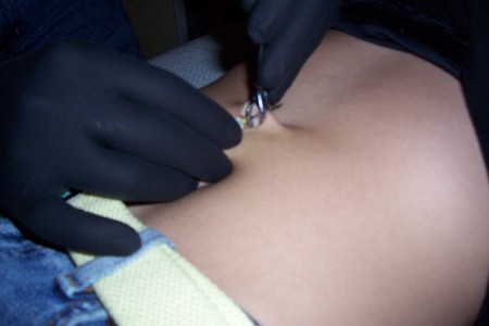 Giving a navel piercing to a friends girlfriend