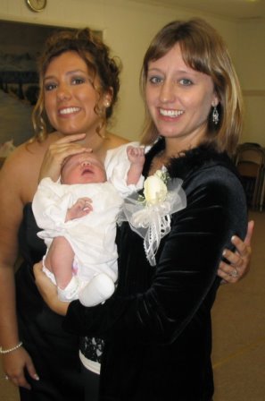 Susie (my sister) and I with her new baby Emilie at Tj's Wedding