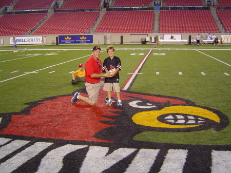 Tim and son Jordan on Univ. of Louisville Football field Aug 2005