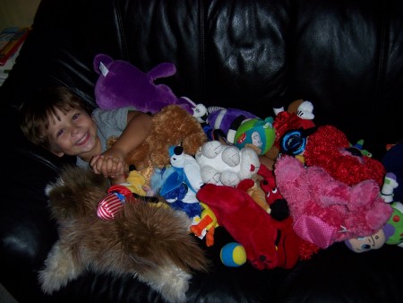 Aiden ~ surrounded by toys