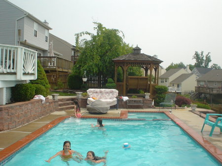 my kids and friends in our pool