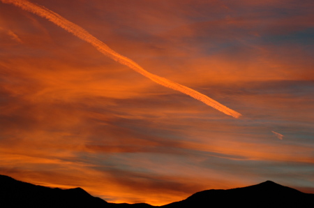 Sunset with contrail