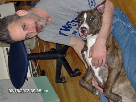 Daddy and puppy snuggling