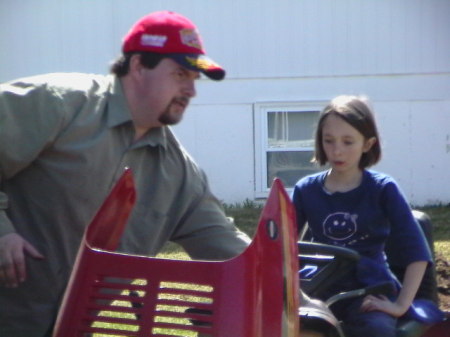 Jimmy and Kendall working on tractor