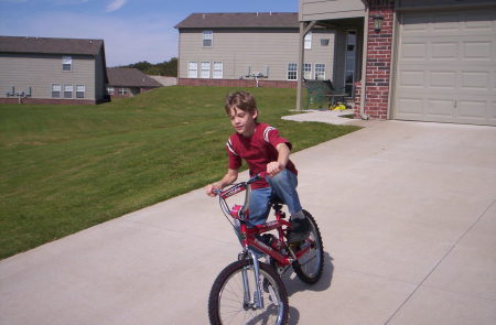 Timothy on his new bike.