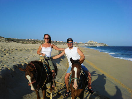 Riding horses on the beach in Cabo, Mexico