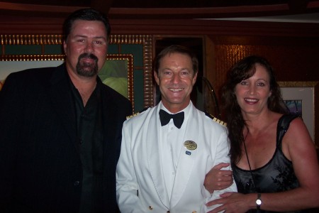 My husband and I with the Captain of the Tahitian Princess Cruise Ship