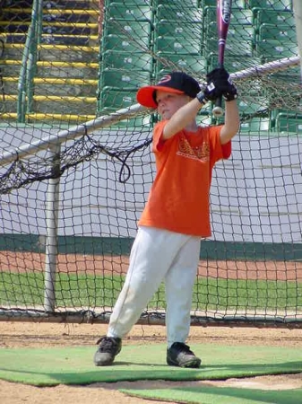 My 5-yr. old son taking some swings in 2005